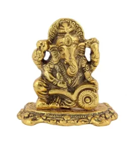 Ganesh ji reading account book with om and swastik carved on book