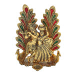 metal made radha krishna jodi with peacock dancing and a deepak in front